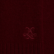 Close-up of a deep red lightweight Filou Cashmere Tank featuring an embroidered monogram logo.