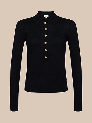 The Sterling Sweater is a premium black knit long sleeve polo with a collared neckline and six gold buttons down the front, shown on a beige background.