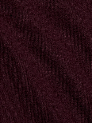Close-up of the Maeva One-Shoulder Top by L'AGENCE, featuring dark burgundy slim-fit knit fabric with a fine diagonal texture and visible fibers.
