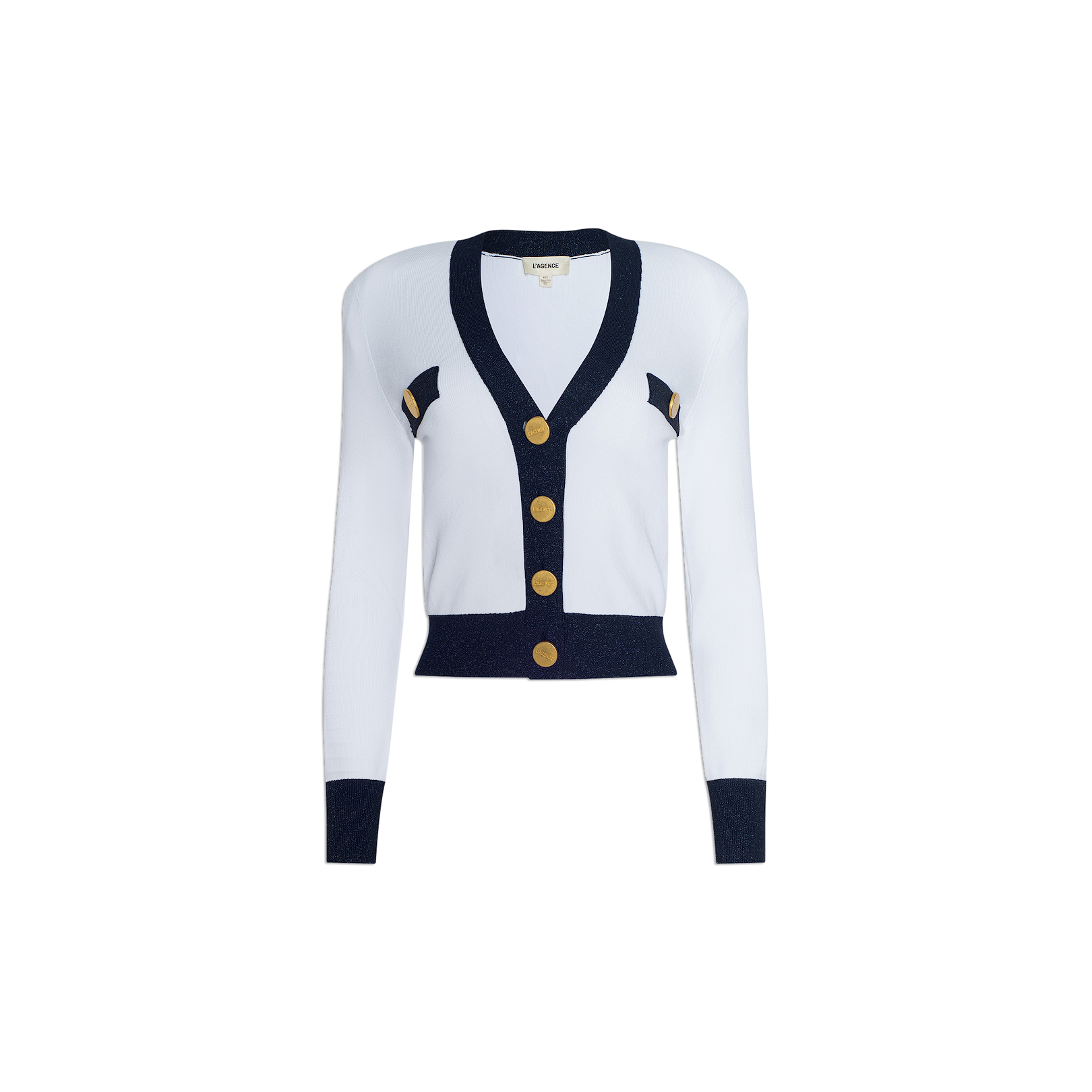 The Taya Cardigan is a Parisian-inspired white long-sleeve cardigan with navy blue trim, accented by gold buttons and elegant metallic detailing throughout. Decorative gold and navy accents adorn the sides, all showcased against a plain white background.