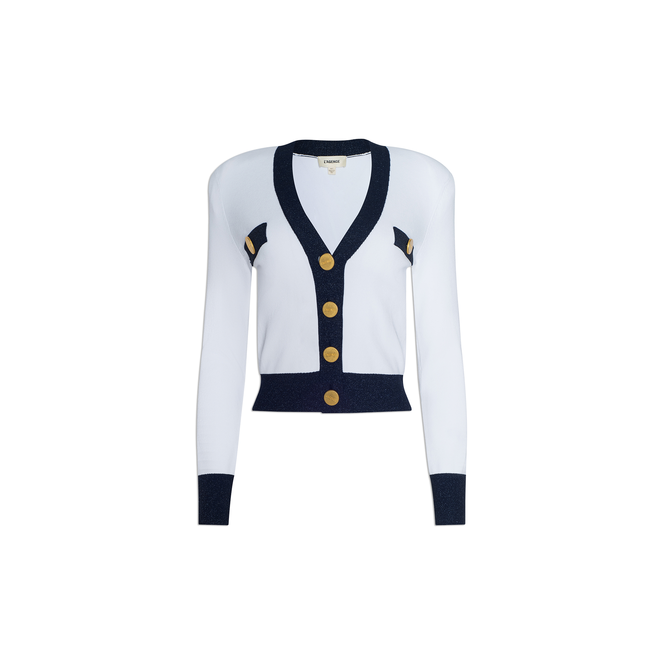 The Taya Cardigan is a Parisian-inspired white long-sleeve cardigan with navy blue trim, accented by gold buttons and elegant metallic detailing throughout. Decorative gold and navy accents adorn the sides, all showcased against a plain white background.