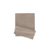 Folded pebbled tan Palais Cashmere Scarf with a ribbed hem.