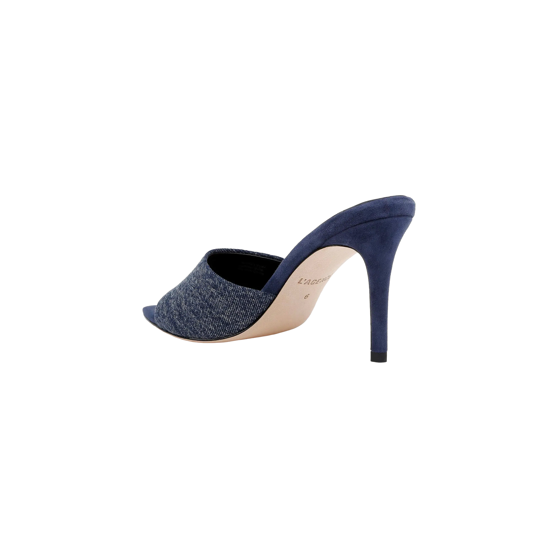 The Lolita Denim Open-Toe Mule, featuring a denim upper and a blue suede stiletto heel, is shown from the side and slightly behind against a white background.