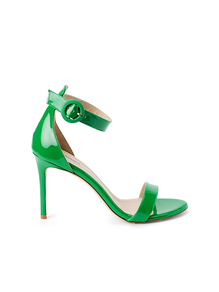 Meet the Rosette Sandal: crafted in vibrant green patent leather, this chic design features a single toe strap and a delicate ankle strap finished with a round buckle. A slim stiletto heel and light tan insole complete the look, infusing modern elegance into every step.