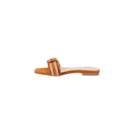 The Aurelie Buckle Sandal is a square-toed sandal with a tan sole, showcasing a wide orange strap accented by white stripes and finished with a bamboo buckle detail across the foot.