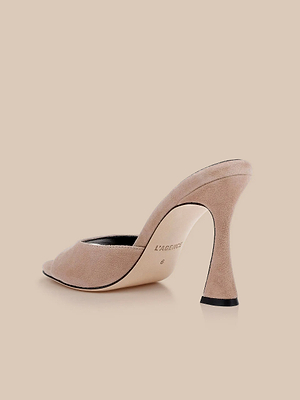 The Avery Suede Open-Toe Mule in cappuccino features a sculpted stiletto heel, open toe, and smooth insole stamped with L’AGENCE and size 6, shown from the back side angle.