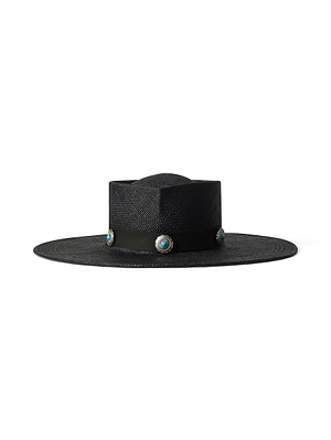 The Adilah Wide-Brim Fedora is a flat-top black hat with a leather band and four silver conchos featuring turquoise stones, handcrafted in LA and shown against a plain white background.