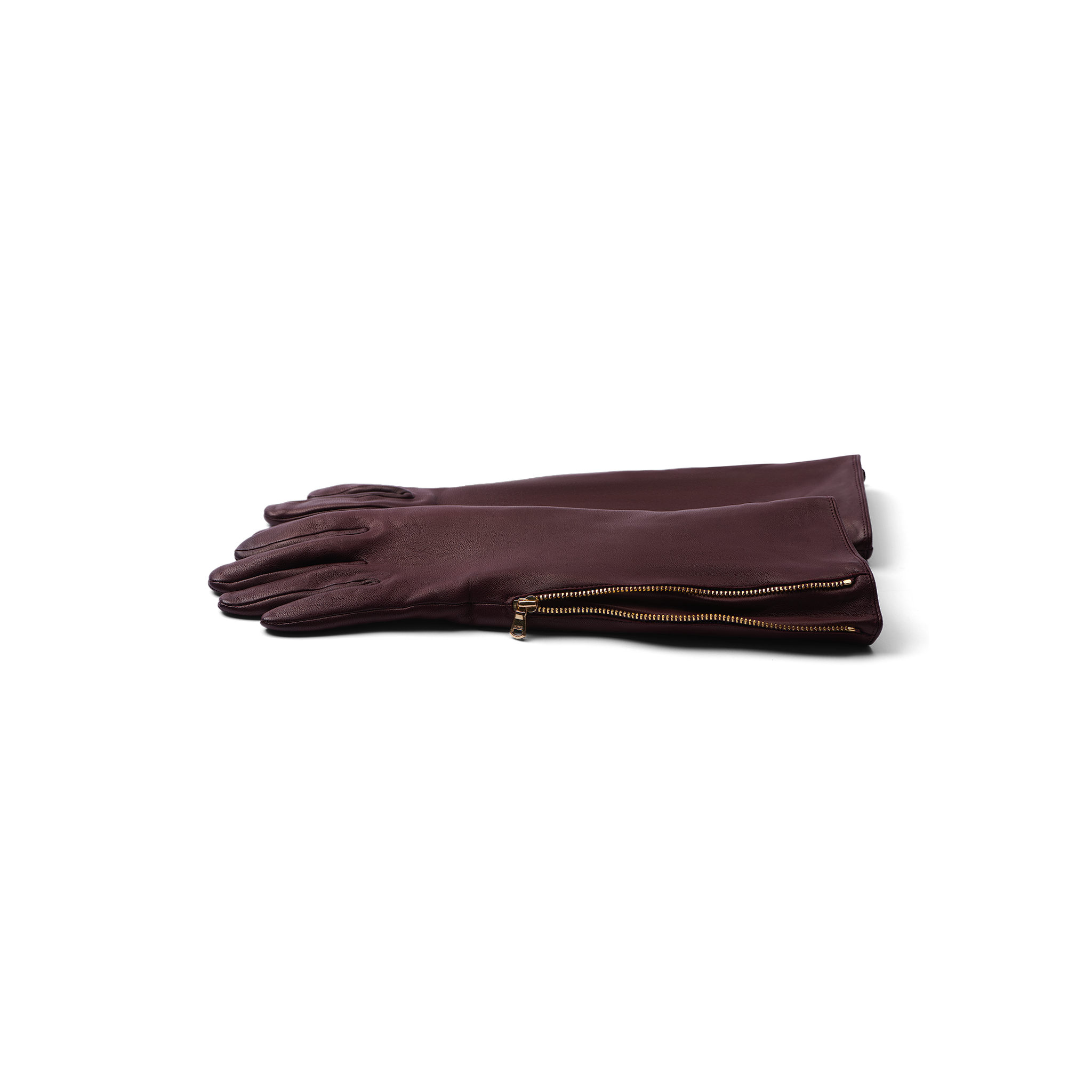 A pair of Carmen Gloves crafted from long, dark brown lambskin leather with gold side zippers, neatly stacked on a white background.