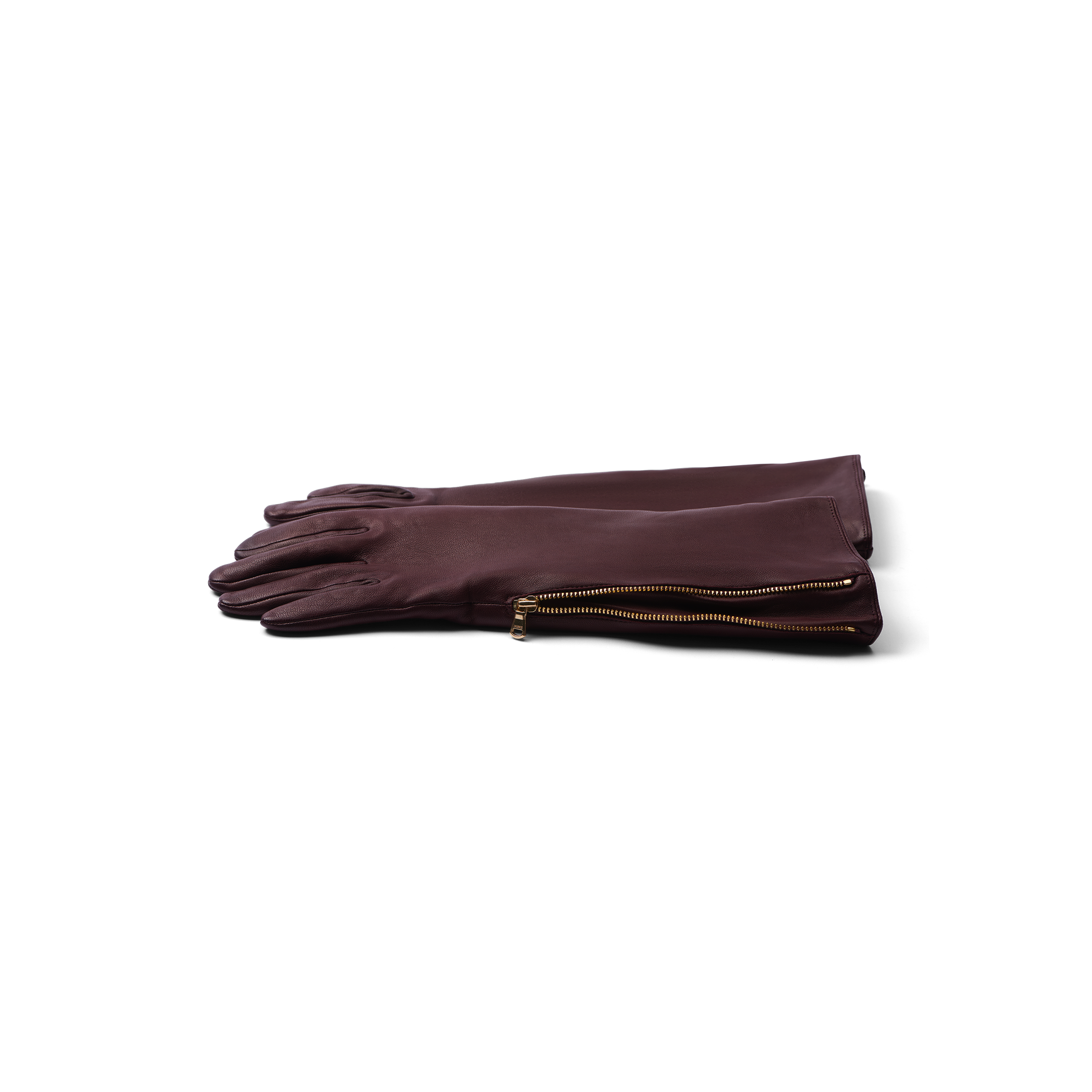 A pair of Carmen Gloves crafted from long, dark brown lambskin leather with gold side zippers, neatly stacked on a white background.