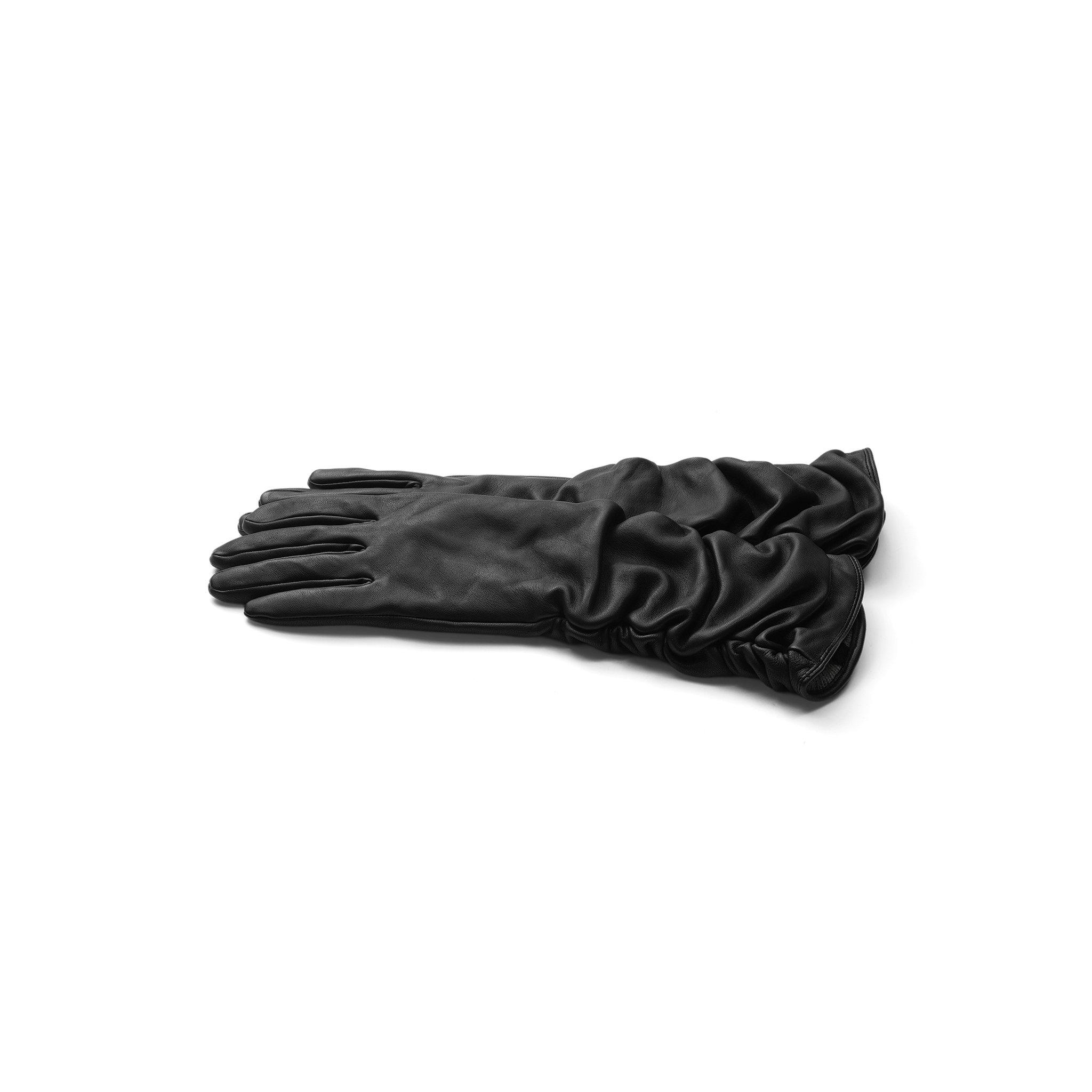 A pair of Ballad Gloves, crafted from ruched black lambskin leather, is neatly stacked on a plain white background, showcasing their refined luxury.