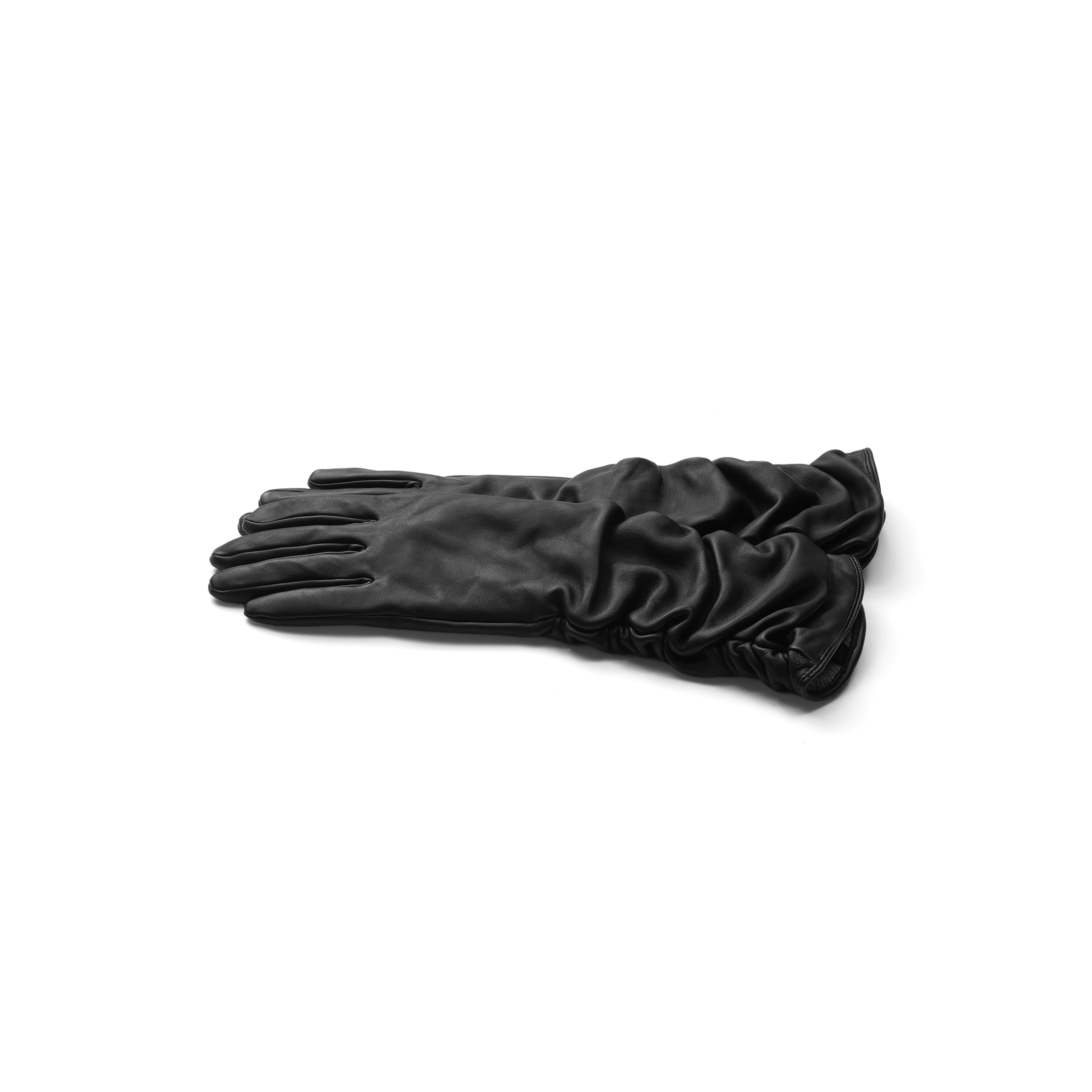 A pair of Ballad Gloves, crafted from ruched black lambskin leather, is neatly stacked on a plain white background, showcasing their refined luxury.