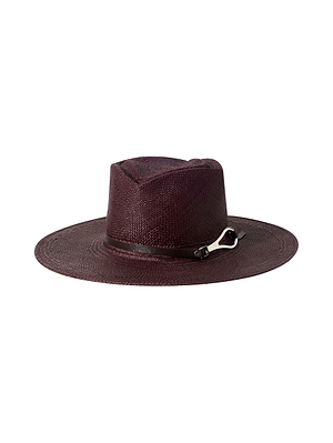 The Estella Fedora by L'AGENCE is a wide-brimmed, dark burgundy handcrafted straw hat with a shallow crown, matching band, and small silver buckle detail, displayed against a white background.