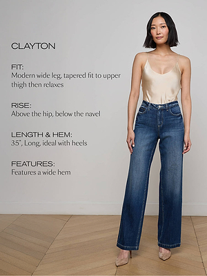 A woman wearing a cream camisole and high-waisted, wide-leg blue jeans stands against a light wall. Text beside her describes the jeans modern fit, 35 length, wide hem, and that they sit above the hip and below the navel.