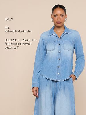 A woman models a light blue, relaxed fit denim shirt with full-length sleeves and button cuffs. Text on the image describes the shirts fit and sleeve length against a beige background.