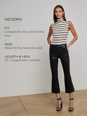 A woman stands indoors wearing black cropped bootcut pants and a sleeveless, striped turtleneck top. Text beside her describes the pants fit, rise, and length, and she poses with one hand on her hip.