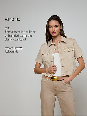 Woman wearing a beige short-sleeve denim jacket with text describing the fit and features.