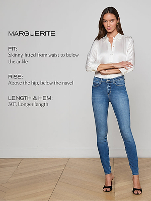 A woman stands in a white blouse and skinny blue jeans with black heels. Text beside her describes the jeans fit as skinny, rise as above the hip, and length as 30 inches with a longer hem.