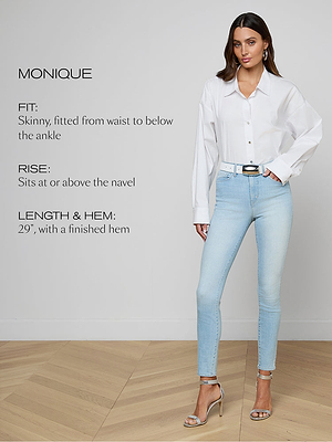 A woman stands indoors wearing a white button-down shirt tucked into light-wash skinny jeans with a white belt and silver heels. Text describes the jeans fit, rise, and hem length.