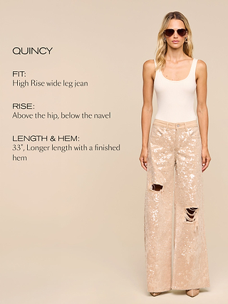 A woman wears high-rise, wide-leg sequin jeans with a white tank top and sunglasses. Text describes fit as high-rise, wide-leg; rise above hip, below navel; and length as 33 inches with a finished hem.