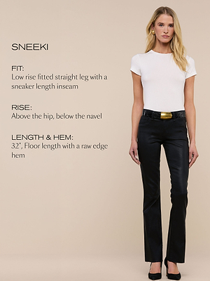 A woman in a white t-shirt, black belted straight-leg pants, and black heels stands against a beige background. Text describes the pants fit: low rise, straight leg, sneaker length, and raw edge hem.