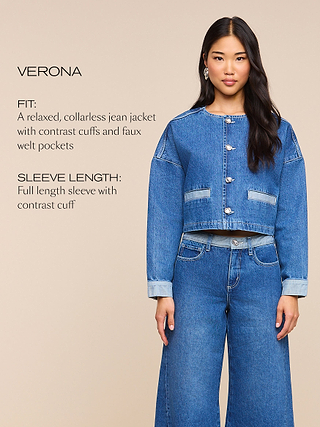 A woman wears a relaxed, collarless denim jacket with cuffed sleeves and faux welt pockets, paired with wide-leg jeans. Text describes the garments fit and sleeve length.