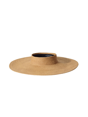 The Flor Visor by L'AGENCE is a woven straw hat with a flat crown and circular brim, providing excellent sun protection. Shown against a white background.