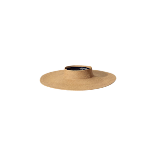 The Flor Visor is a wide-brimmed, light brown straw hat with a flat crown, perfect for sun protection and displayed on a plain white background.