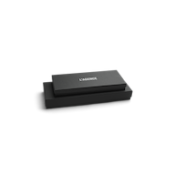 Two sleek black rectangular boxes are stacked, with the top box labeled LAGENCE in white, all set against a plain white background—evoking the refined elegance of Tempo Mittens by L’AGENCE.