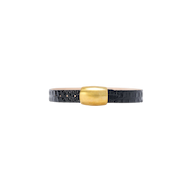 The Milou Belt is a black, croc-embossed leather accessory featuring a wide, rectangular gold clasp, handcrafted in LA and displayed on a plain white background.