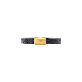 The Milou Belt, a black, handcrafted-in-LA textured leather accessory with a large, rectangular gold-toned metal buckle, is displayed on a plain white background.