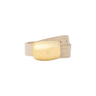 The Milou Belt is showcased against a plain white background, featuring beige croc-embossed leather and a large, rectangular brass buckle.