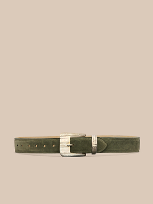 Handcrafted in LA, the Aya Suede Belt features Italian olive green suede, a silver engraved rectangular buckle, and a matching belt loop—all set against a plain beige background.