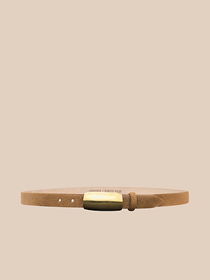 The Marlowe Belt, handcrafted in LA from Italian-sourced tan calf hair leather, features a sleek rectangular gold buckle and is displayed against a beige background.