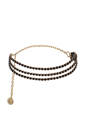 The Alisha Chain Belt features three black woven strands and a dangling chain extension with a round gold charm, shown on a white background—an elegant handcrafted accessory for any occasion.