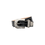 The Otera Leather Belt, crafted from black croc-embossed leather, features an ornate floral-engraved silver buckle with intricate patterns, as well as a coordinating metal belt loop and tip. It is displayed on a white background.