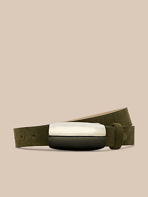 The Marlowe Suede Belt in olive green features minimalist tailoring and a standout, two-toned silver-plated buckle, set against a plain beige background.