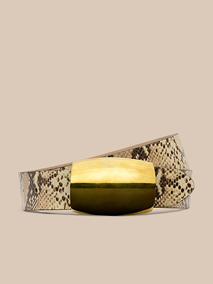 The Milou Belt, featuring a snake-embossed design and a large rectangular brass buckle, is displayed against a neutral beige background.