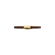 The Machado Suede Belt, a slim brown Italian suede accessory, features a ribbed, oval-shaped gold buckle and is displayed against a plain white background. This belt highlights refined craftsmanship and timeless style.