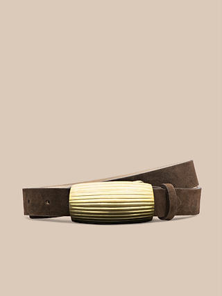 The Machado Suede Belt, crafted from slim Italian suede in a rich brown shade and finished with a textured, rectangular gold buckle, is displayed against a plain beige background.