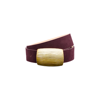 The Montell Suede Belt is a burgundy suede belt featuring a wide, rectangular brass buckle with horizontal textured lines. Handcrafted in LA, it is displayed against a plain white background.