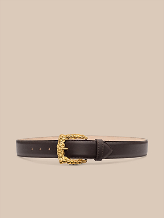 The Marcaeu Belt, handcrafted in LA from dark brown Italian leather and featuring a gold-plated ornate buckle, is displayed against a plain beige background.