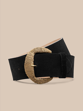 The Roden Suede Belt, a wide black Italian leather belt featuring a large, textured gold-plated buckle, is displayed against a beige background.