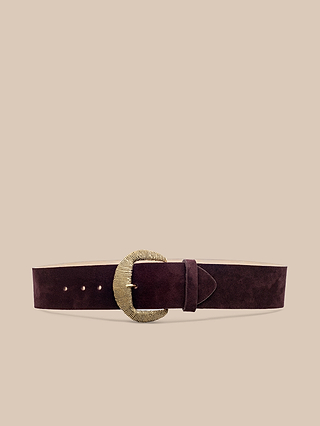 The Roden Suede Belt, featuring a wide, deep burgundy suede strap and a large round gold-plated textured buckle, is displayed centered on a plain beige background.