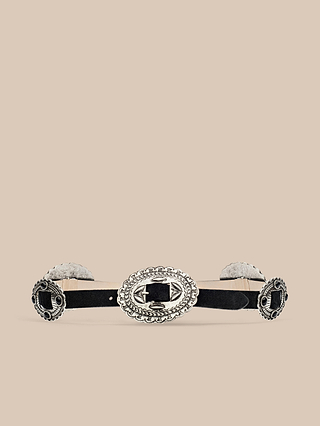 The Rocha Leather Belt, handcrafted in LA from premium Italian leather, features ornate silver oval conchos with engraved detailing and is shown here in black against a neutral beige background.