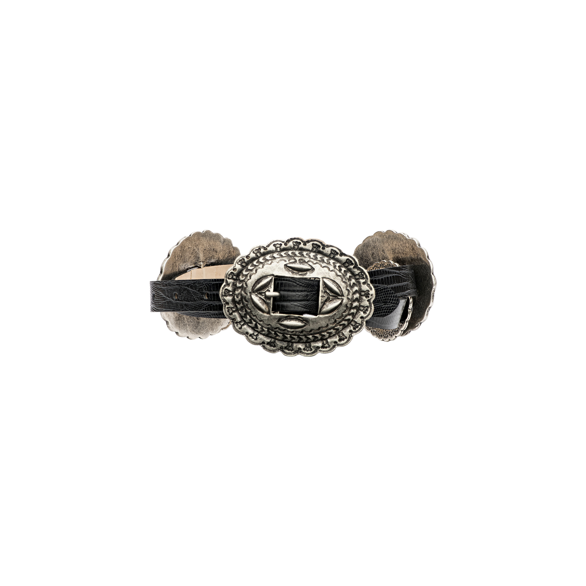 A decorative belt crafted from handcrafted Italian leather, featuring an ornate, silver-toned central medallion with intricate patterns and a black woven detail. The Rocha Leather Belt is finished with additional silver accents on each side.