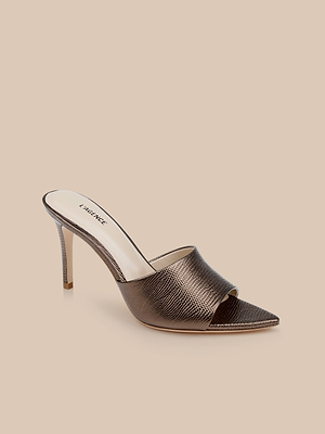 The Lolita Leather Open-Toe Mule, featuring lizard-embossed metallic bronze leather, a pointed front, and a stiletto heel, is shown on a neutral beige background.