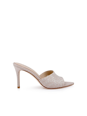 The Lolita Linen Open-Toe Mule features a beige linen upper with delicate floral embroidery, open toe, and a sleek stiletto heel, shown on a white background.