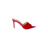 The Lolita Suede Open-Toe Mule, featuring a high heel, red suede upper, pointed toe, and a pink sole, is displayed on a plain white background.
