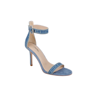 The Gisele Denim Sandal is a single ankle-strap sandal in blue denim, featuring a denim upper, open toe, sleek ankle strap with buckle, and a slim stiletto heel, displayed on a white background.