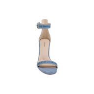 The Gisele Denim Sandal features a blue denim upper with an ankle strap and buckle, a high heel, and an open toe, shown from the front against a plain white background.